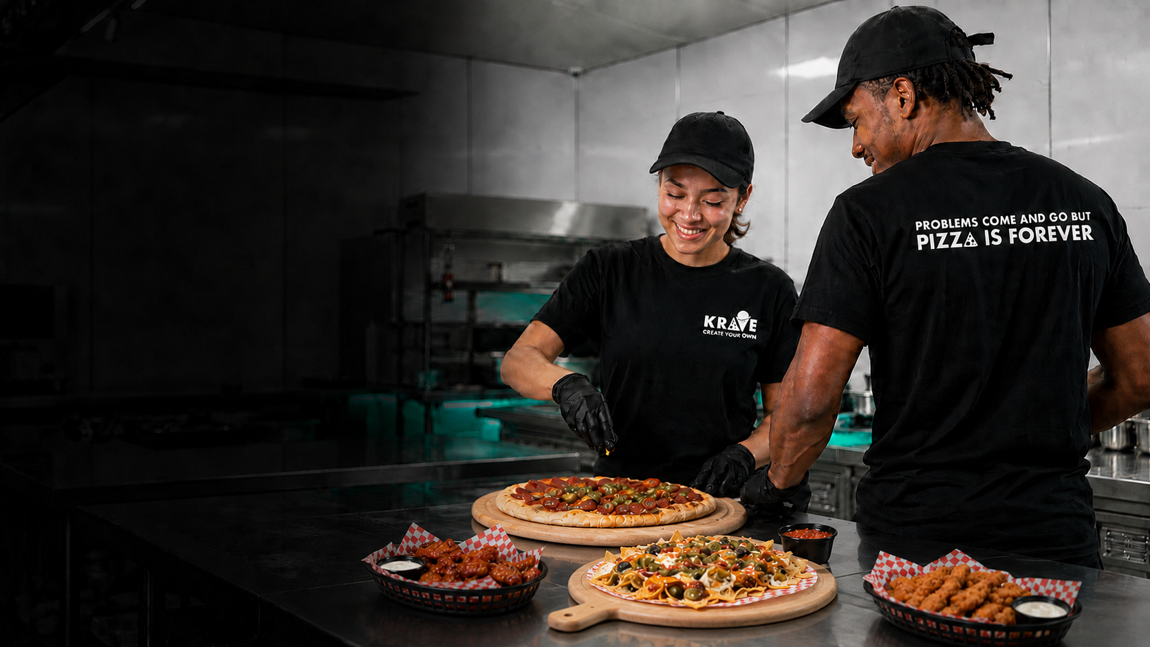 Krave team members preparing pizza, nachos, wings, and tenders in a back-of-house kitchen