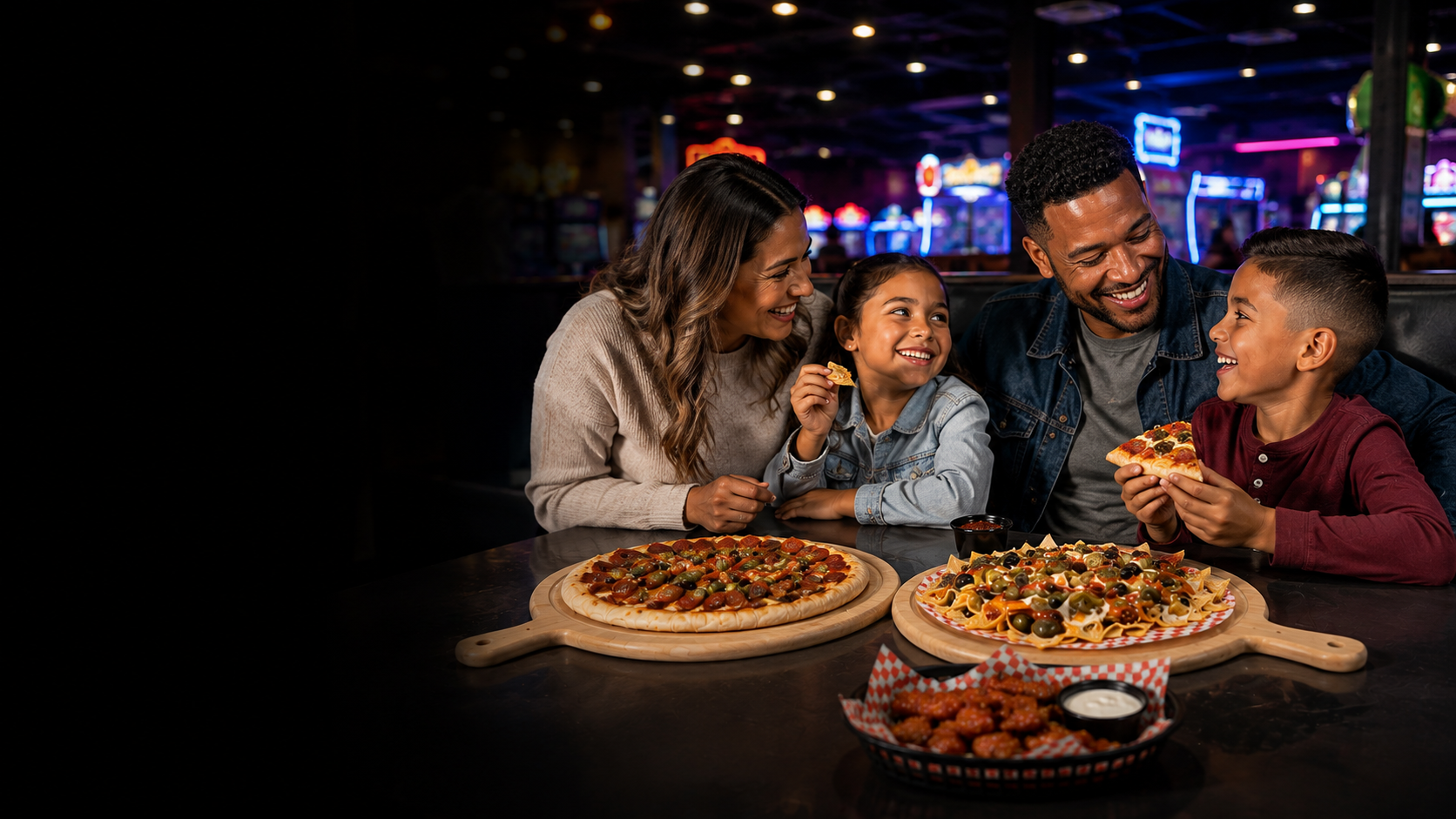 A family enjoying Krave pizza, nachos, and a basket item together at Launch