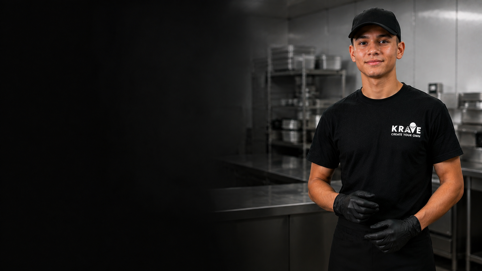 A shift-ready Krave employee in a clean back-of-house kitchen wearing the approved uniform, hair restraint, and food-service gloves