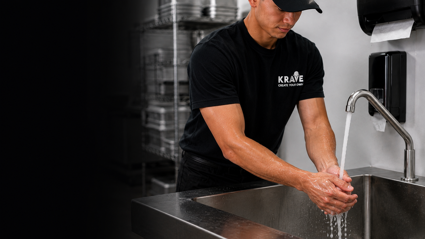 A Krave employee wetting bare hands and forearms under running water