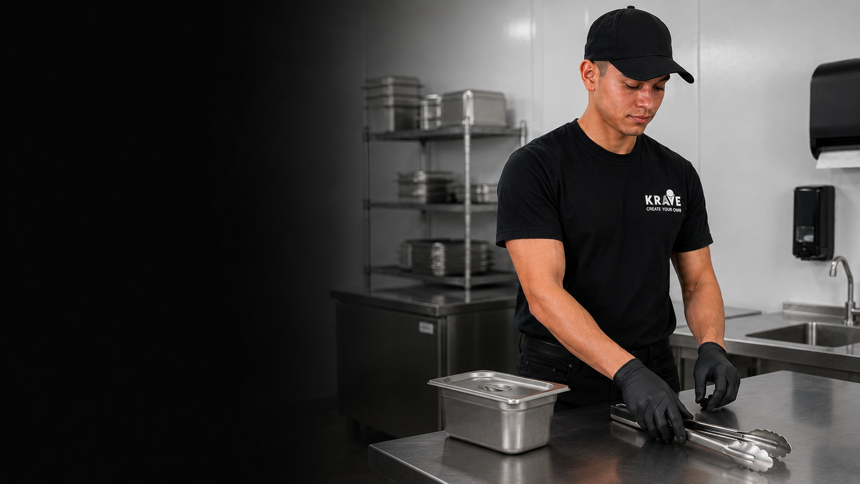 A Krave employee beginning food preparation with clean gloves and clean stainless-steel tongs