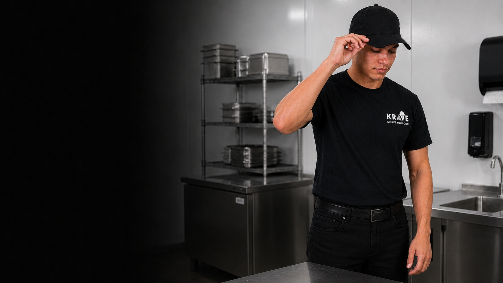 A Krave employee adjusting a cap away from exposed food
