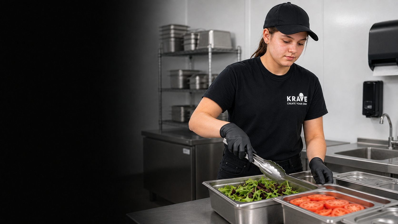 A teenage Krave employee using clean tongs to handle ready-to-eat vegetables