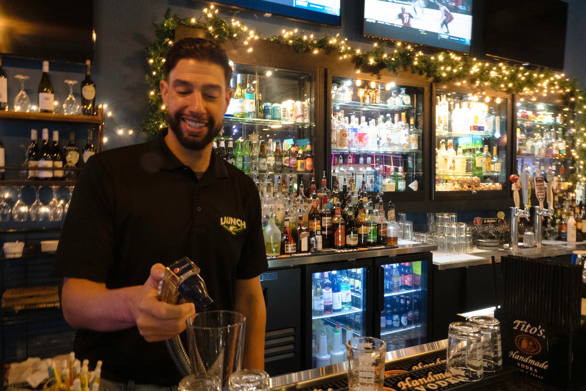 Launch team member preparing a guest beverage